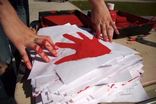 Red_hands_stack_lightened_web-600x399